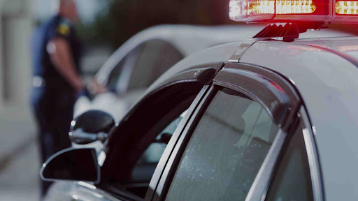 A driver gets stopped by the police for a red light violation in New Jersey.